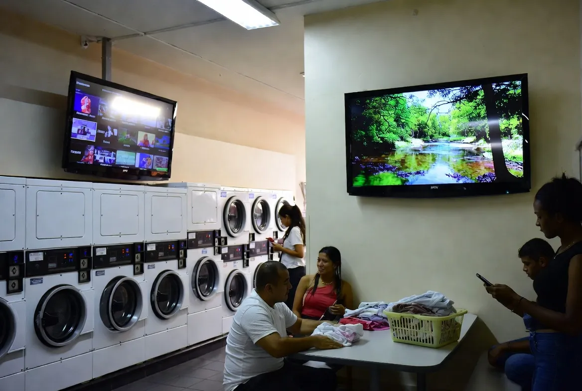 Laundromat with TVs streaming IPTV content for waiting customers