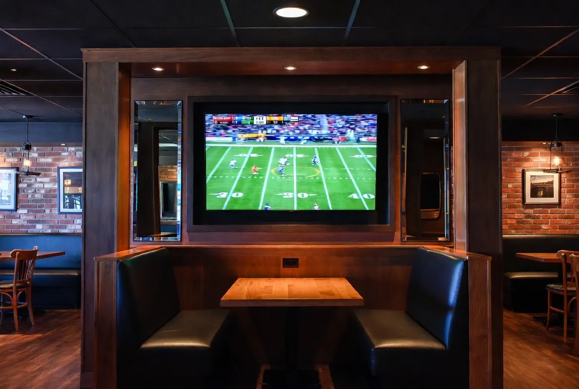 NFL game live on a sports bar TV powered by IPTV